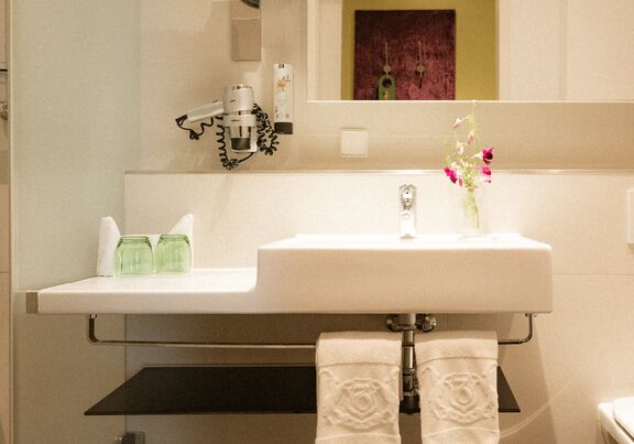 Badezimmer im Hotel Capricorno Wien